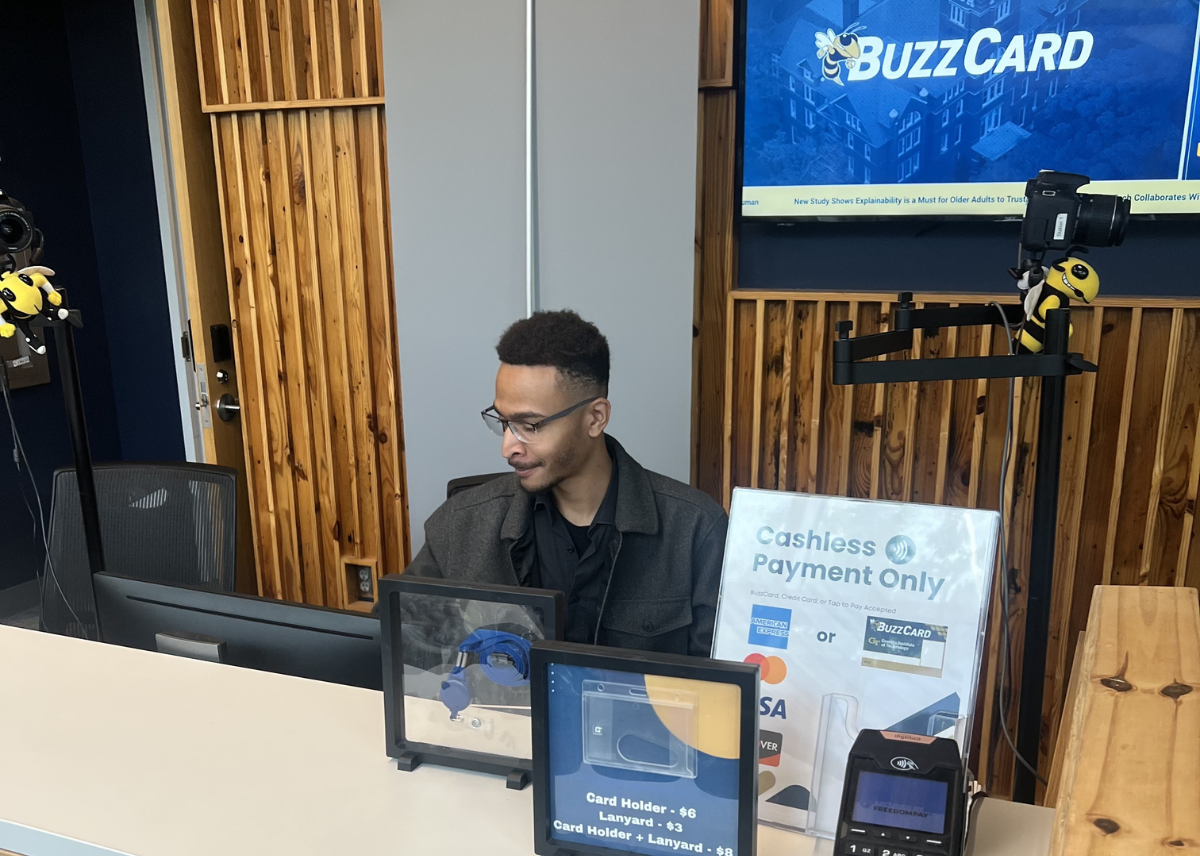 staff member sitting at the Buzz STOP desk